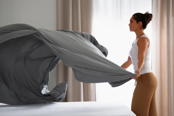 What are the benefits of investing in high-quality linens for temperature control?